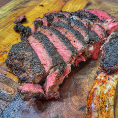 A Sliced rib eye seasoned in Moonshine BBQ Nero Steak Rub